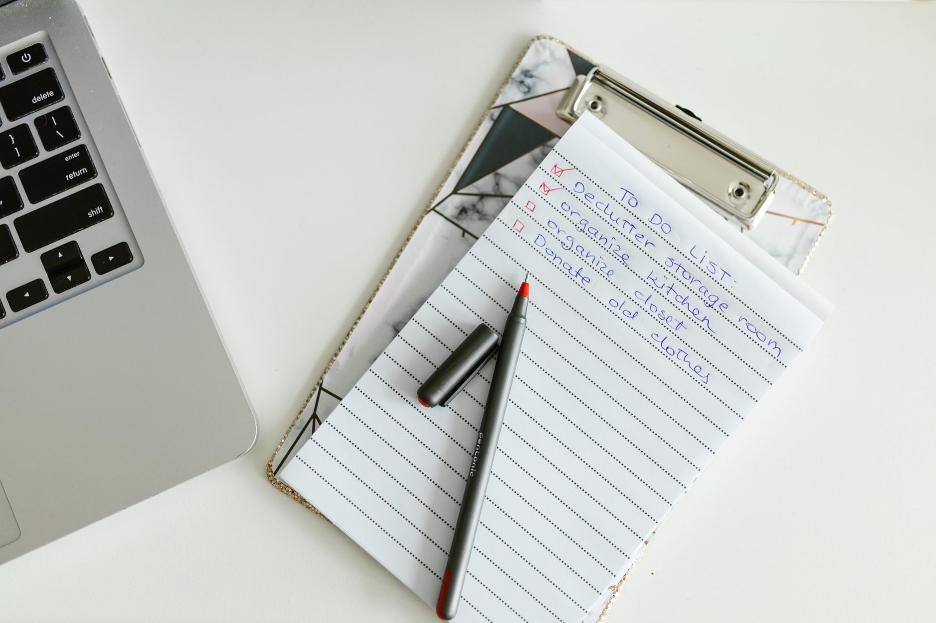 Neatly organized retirement readiness checklist on a clipboard next to a laptop