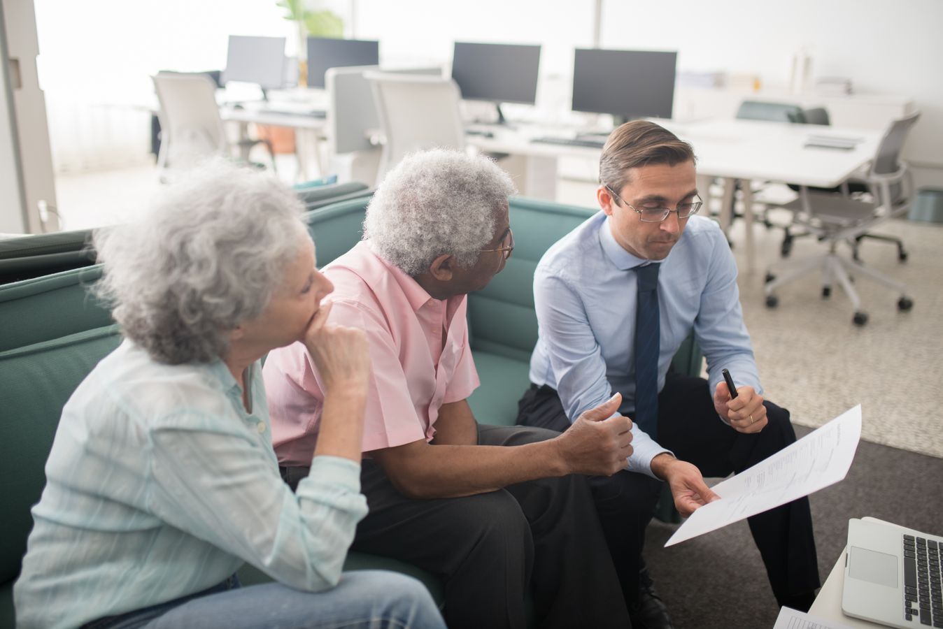 Retired couple asking an insurance agent whether annuities are worth it for retirees