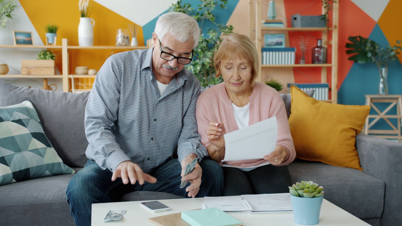 Senior couple reviewing accounts to plan their tax-efficient withdrawal order in retirement
